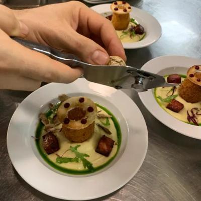 deep Fried egg with chorizo, celery-truffle pure and chives green oil.