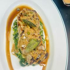 sirloin with butter spinach and pepper corn sauce and sage on top
