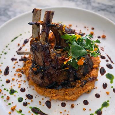 Charcoal-Grilled Lamb Chops with Sweet Potato Purée, Herb Oil & Red Wine Jus
