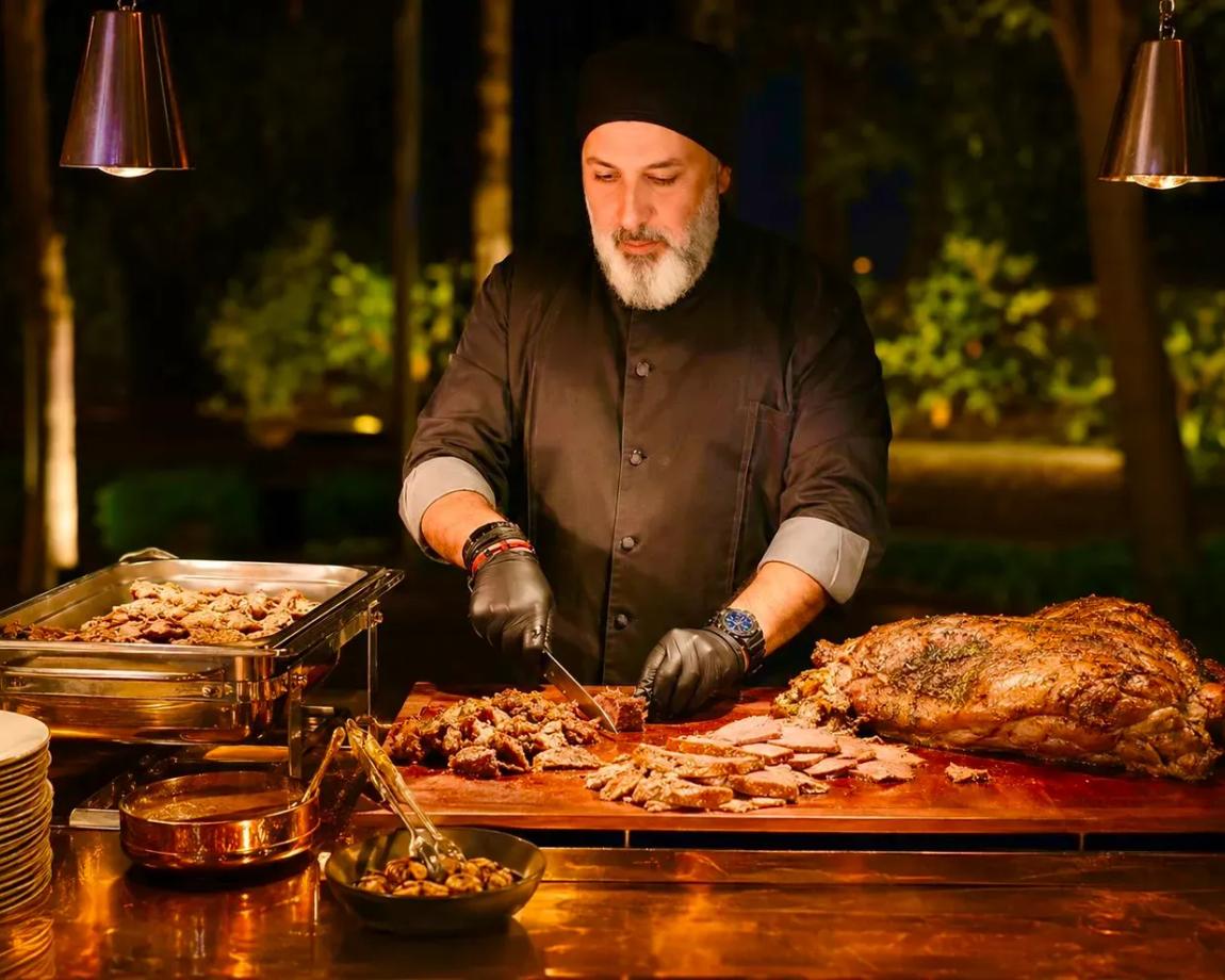 Live European BBQ station featuring freshly grilled meats,prepared and served live for guests