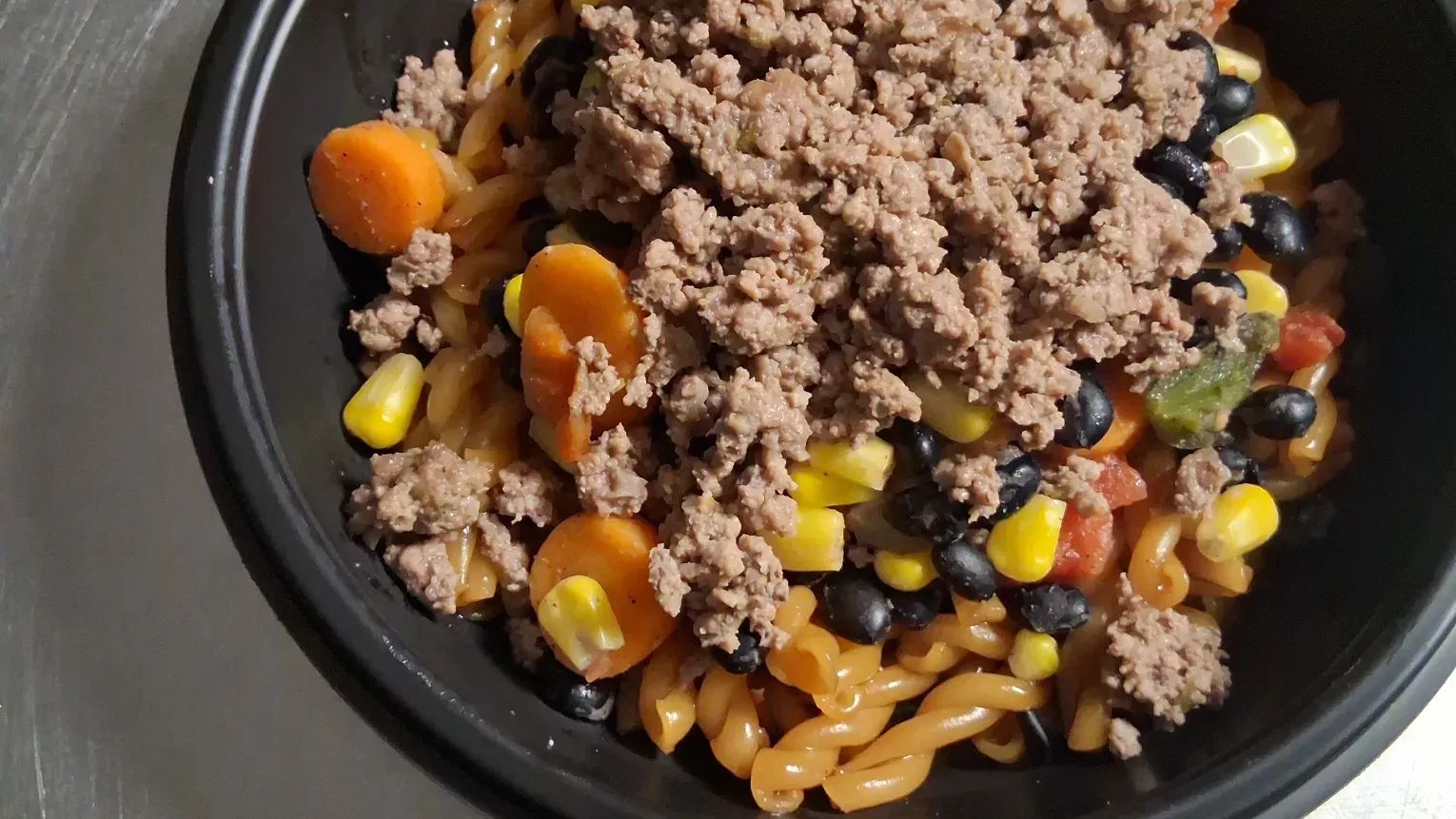 asain beef pasta bowl with  veggies 